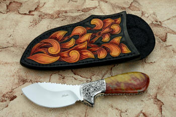 "Nunavut" obverse side view in 440C high chromium stainless steel blade, hand-engraved 304 stainless steel bolsters, agatized, jasper petrified wood gemstone handle, hand-carved, hand-dyed leather sheath