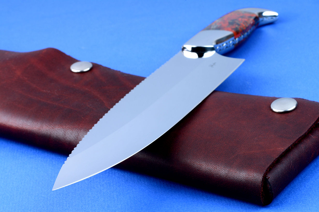 "Concordia" fine master chef's knife, obverse side view in CPM154CM high molybdenum powder metal technology tool steel blade, 304 stainless steel bolsters, Brecciated African Jasper gemstone handle, chef's roll case in latigo side leather and leather shoulder, hand-tooled, hand stitched with stainless steel snaps