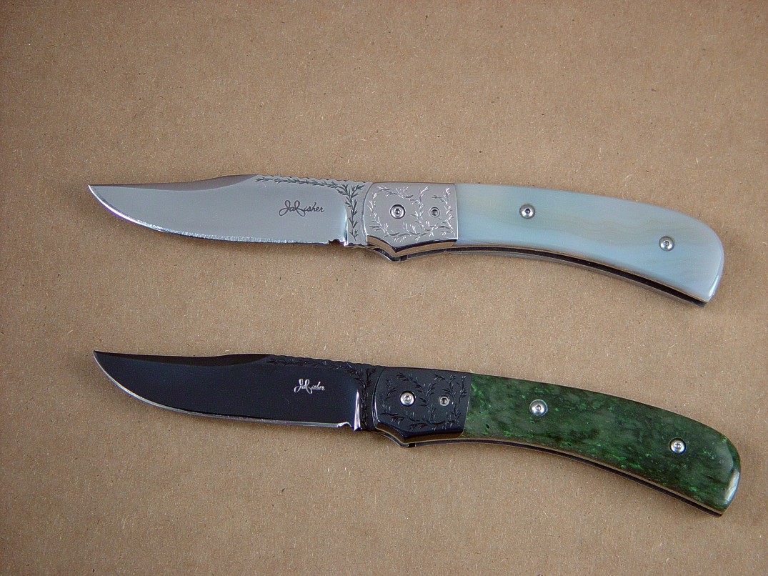 "Gemini" linerlock folding knives: top: 440C high chromium stainless steel blade, 304 stainless steel bolsters, 6AL4V titanium liners, Agate gemstone handle. All engraving by maker. Bottom: blued O-1 high carbon tungsten-vanadium tool steel blade, blued carbon steel bolsters, 6AL4V titanium liners, Nephrite Jade gemstone handle. All engraving by maker