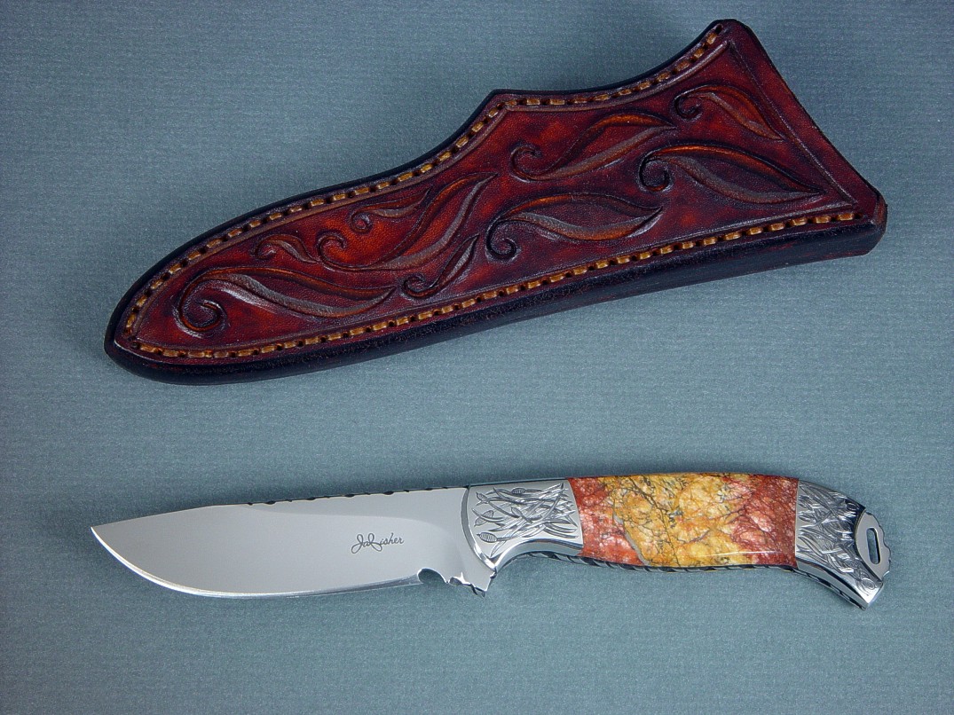 "Izar" obverse side view, knife in 440C high chromium stainless steel blade, hand-engraved 304 stainless steel bolsters, Sunset Jasper gemstone handle, hand-carved leather sheath