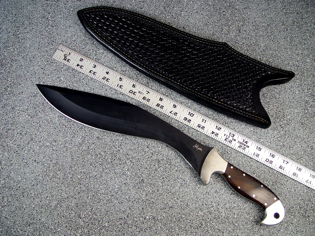 "Phlegra" Khukri, Obverse side view: bead blasted, hot blued O-1 high carbon tungsten vanadium tool steel blade, 304 stainless steel bolsters, Ziricote exotic hardwood handle, hand-tooled leather sheath