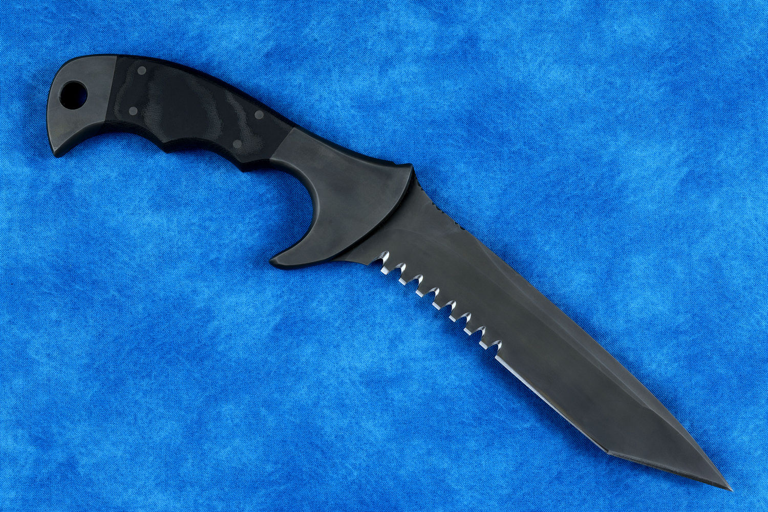 "Uvhash" tactical knife, obverse side view in T4 cryogenically treated ATS-34 high molybdenum martensitic stainles steel blade, 304 austenitic stainless steel bolsters, gray/black Micarta phenolic handle, positively locking sheath in kydex, black oxide stainless steel, 6AL4V anodized titanium, anodized aluminum