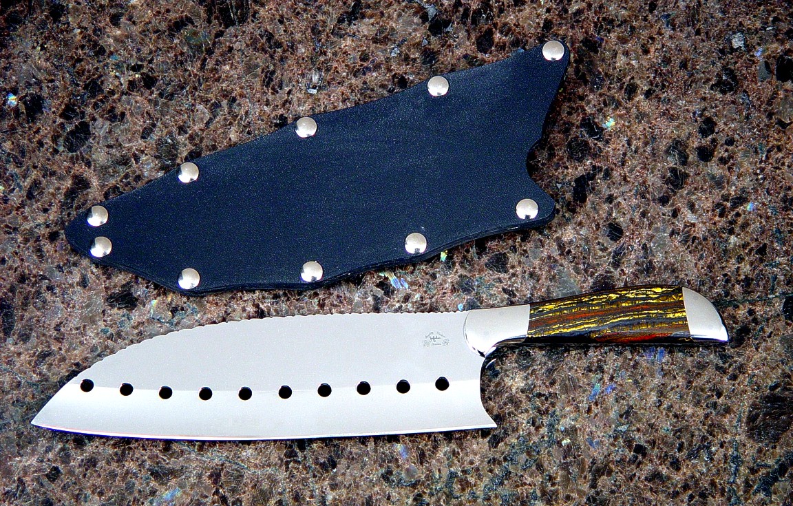 "Vega" master chef's knife, obverse side view in milled 440C high chromium stainless steel blade, 304 stainless steel bolsters, Australian Tiger Iron gemstone handle, slip sheath of kydex, nickel plated steel