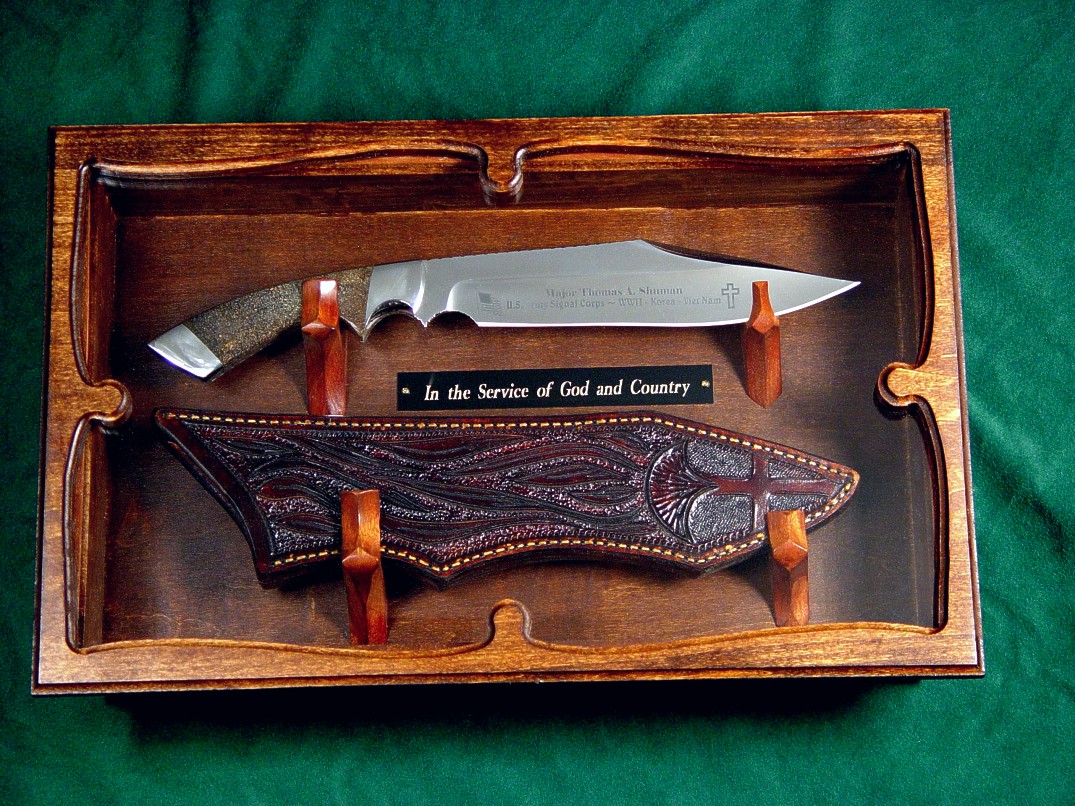 Veteran's knife honoring Major Thomas Shuman: veteran of three wars. Etched 440C high chromium stailess steel blade, 304 stainless steel bolsters, petrified dinosaur bone gemstone handle, hand-carved leather sheath