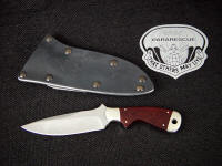 USAF Pararescue "Creature" CSAR tactical knife, obverse side view in bead blasted 440C stainless steel blade, 304 stainless bolsters, burgundy linen micarta phenolic handle, tension kydex, aluminum, blued steel sheath