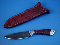 "Rio Grande" obvers side view in blued O1 high carbon tungsten-vanadium alloy tool steel blade, hand-engraved 304 stainless steel bolsters, Honduras Rosewood Burl hardwood handle, hand-stamped basket weave leather sheath