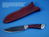 "Rio Grande" obvers side view in blued O1 high carbon tungsten-vanadium alloy tool steel blade, hand-engraved 304 stainless steel bolsters, Honduras Rosewood Burl hardwood handle, hand-stamped basket weave leather sheath